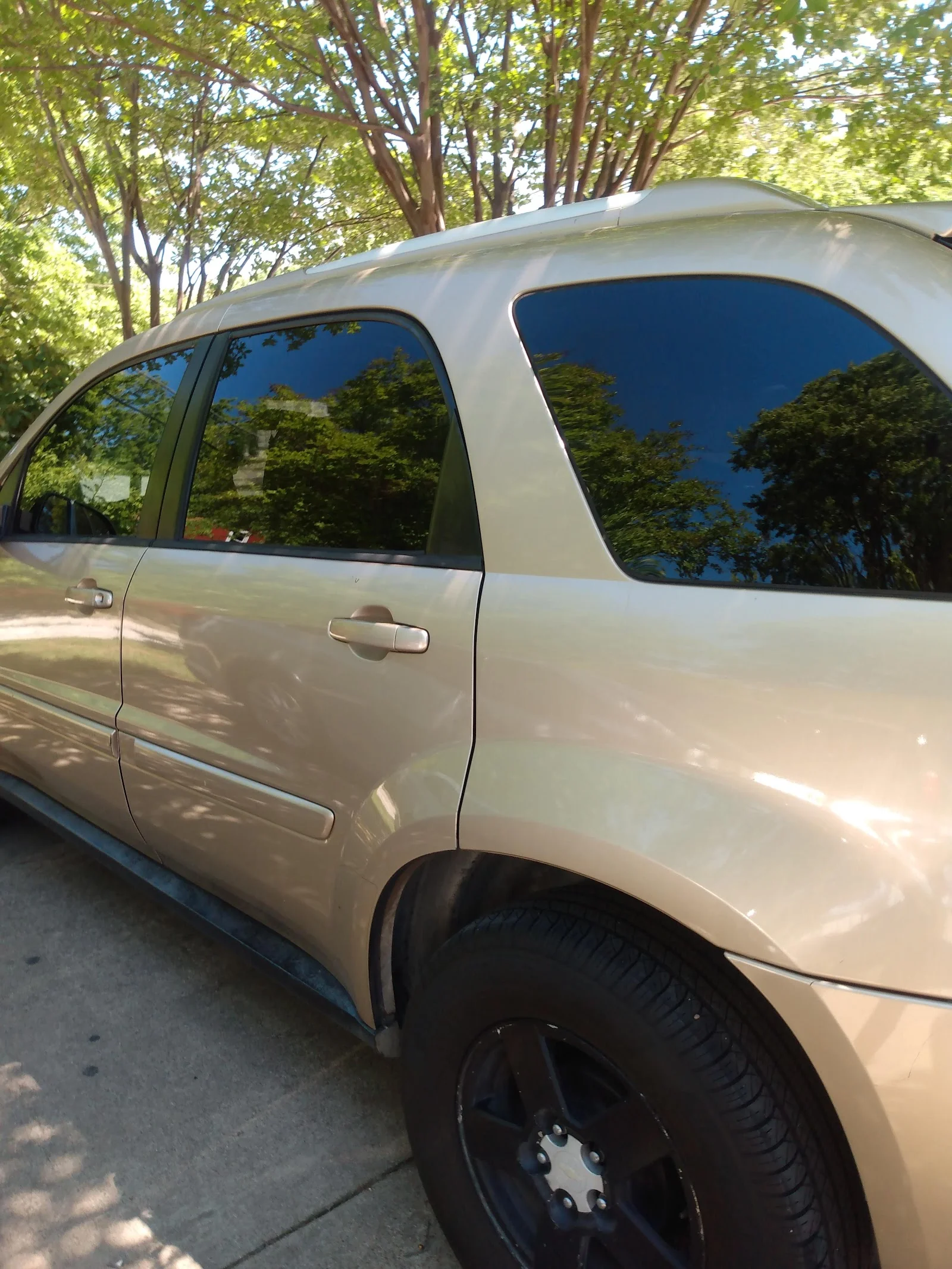 Inside Dimples Window Tinting, shop interior and work bay